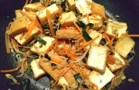 Add ingredients and seasonings to a pan and fry